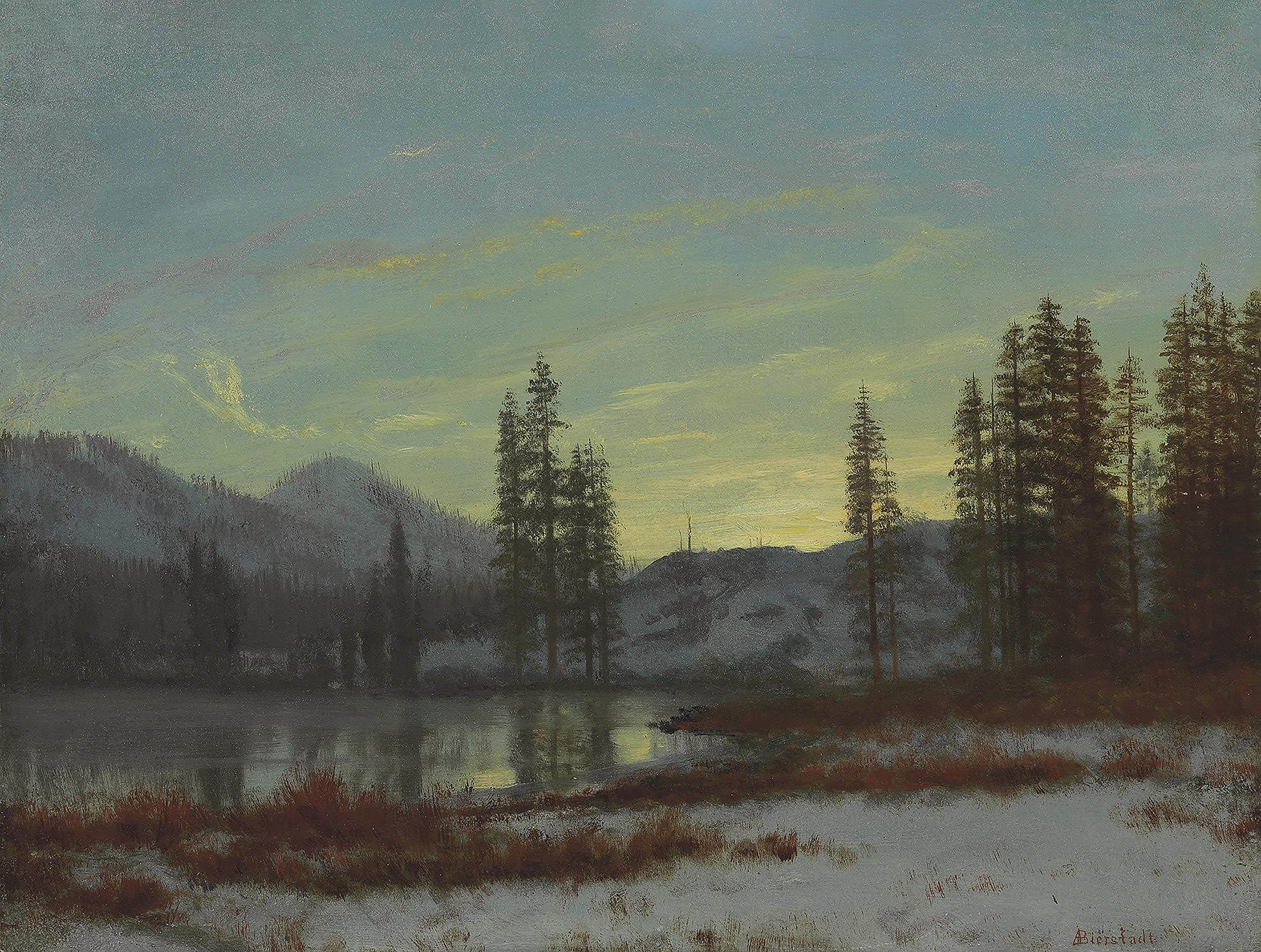 Oil painting of Snow in the Rockies by Albert Bierstadt, featuring a twilight lake bordered by snow-dusted ground and silhouetted conifers beneath a pale yellow and grey-green winter sky.