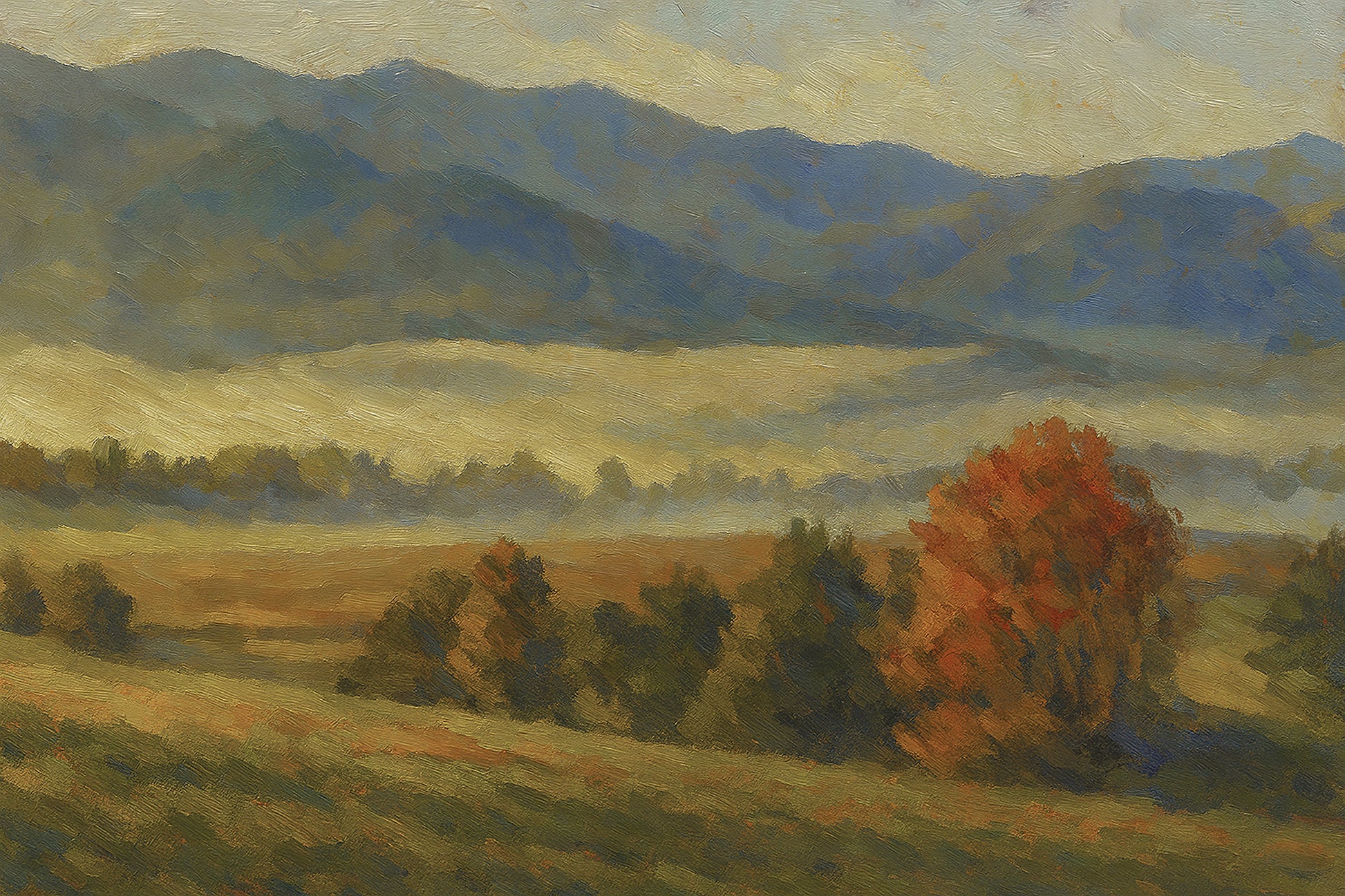 Low morning fog layered across a golden meadow with a red autumn tree and blue mountain ridges beyond.